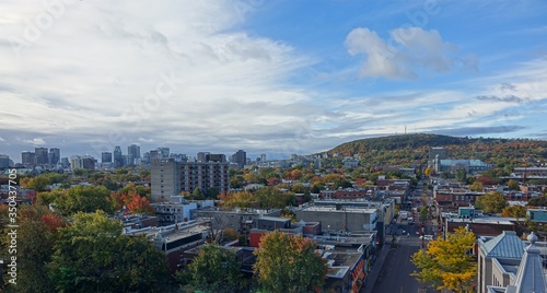 Fototapeta Naklejka Na Ścianę i Meble -  Wide view from the 10th floor of Mont Royal, the Plateau area, the Ville Marie area, and Down-Town. The north-east side of mount Royal. Perspective of Rachel street towards the mountain.
