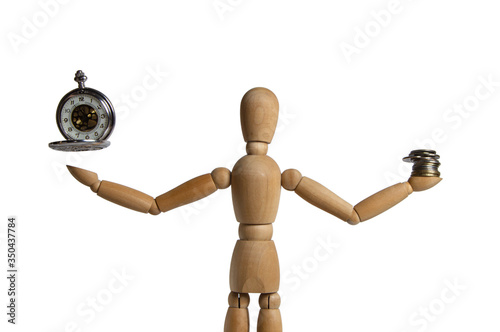 A wooden figure holding a watch and coins. Balance of time and Finance-concept idea