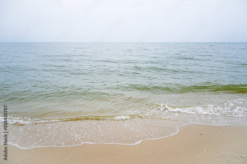 Soft wave with blue ocean on sandy beach. Soft wave with blue ocean on sandy beach.