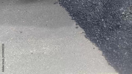 Asphalt paving materials with machines And there is haze from the heat of the material