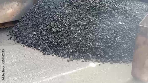Asphalt paving materials with machines And there is haze from the heat of the material
