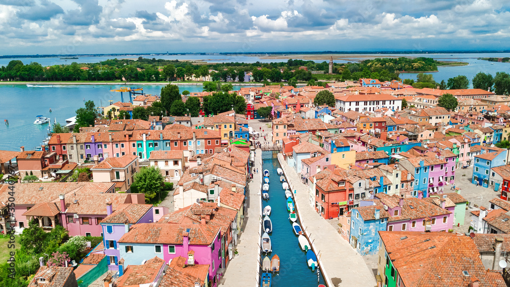 Aerial view of colorful Burano island in Venetian lagoon sea from above, Italy
