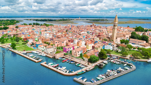Aerial view of colorful Burano island in Venetian lagoon sea from above, Italy 