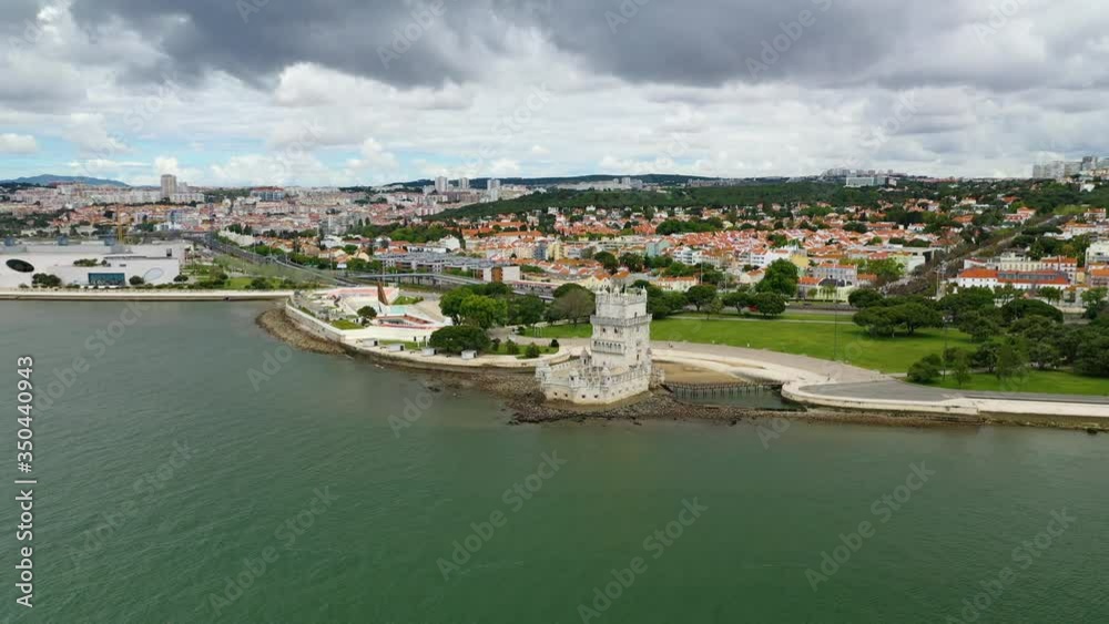 Aerial, orbit, drone view around the empty Belem tower, during COVID-19, partly sunny day, in Lisbon, Portugal Aerial, orbit, drone view around the empty Belem tower, during COVID-19, partly sunny day, in Lisbon, Portugal