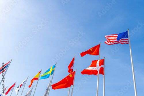 Flagpole international global with blue sky background