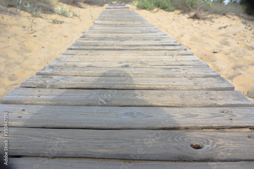 boardwalk leading to the beach on the sand