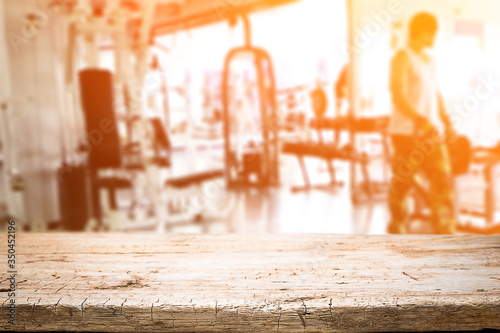 Wallpaper Mural Desk space over  blur fitness gym background. For product display montage. Business presentation. Torontodigital.ca