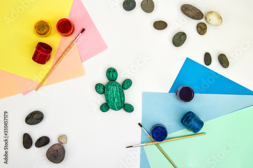 Painting a rock green turtle on a stone step by step. Children art project. DIY concept. Step by step photo instruction. Step 5 photo