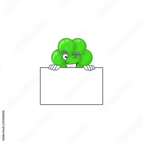 Mascot design style of staphylococcus aureus standing behind a board