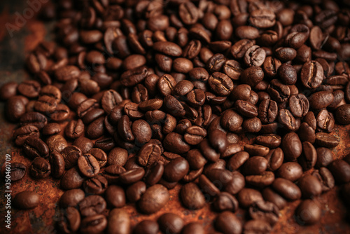 Coffee beans on the rustic background. Selective focus. Shallow depth of field.
