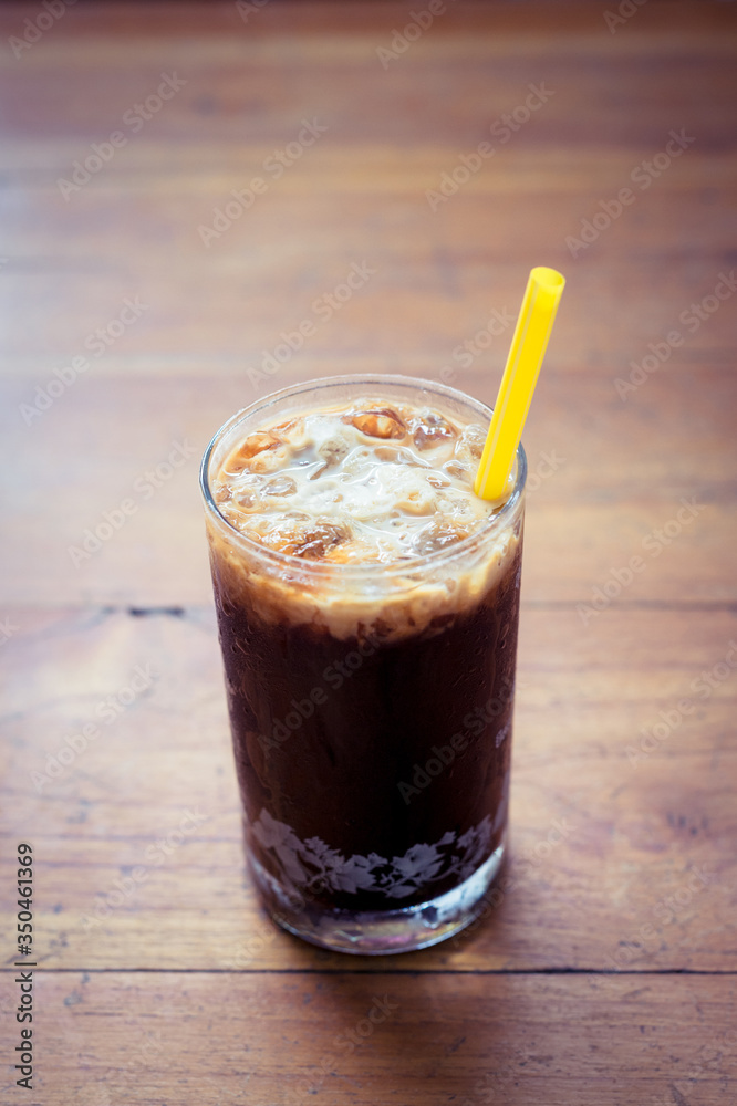 Ice coffee on wooden background Ice coffee on wooden background