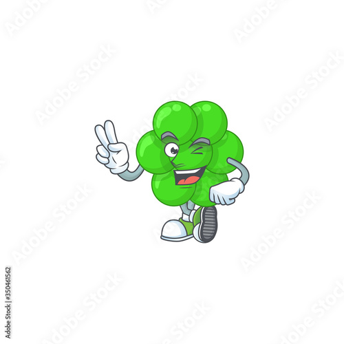 smiling staphylococcus aureus cartoon mascot style with two fingers