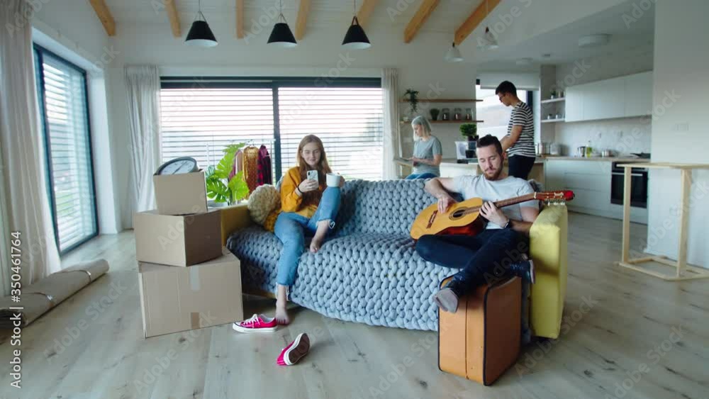 Group of young people with guitar moving in new home, house sharing concept. Group of young people with guitar moving in new home, house sharing concept.