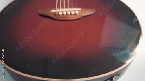 Dolly Shot of a guitar hanging in the bedroom