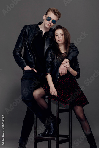 cool man and woman on gray background