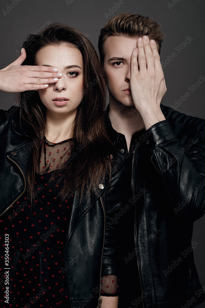 cool man and woman on gray background cool man and woman on gray background