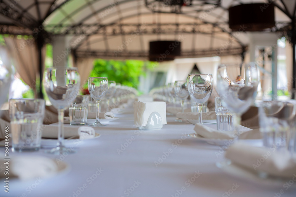 dishes on the table in a restaurant. glasses on the table. wedding party.table setting. table setting for the holiday. birthday celebrations. dishes on the table in a restaurant. glasses on the table. wedding party.table setting. table setting for the holiday. birthday celebrations.