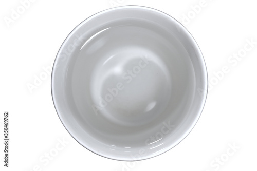 There is a light reflecting the water. The glass is white.water in glass top view for drink isolated White Background