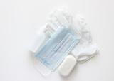 hygiene kit white medical gloves white blue mask white soap and sanitizer on a white background