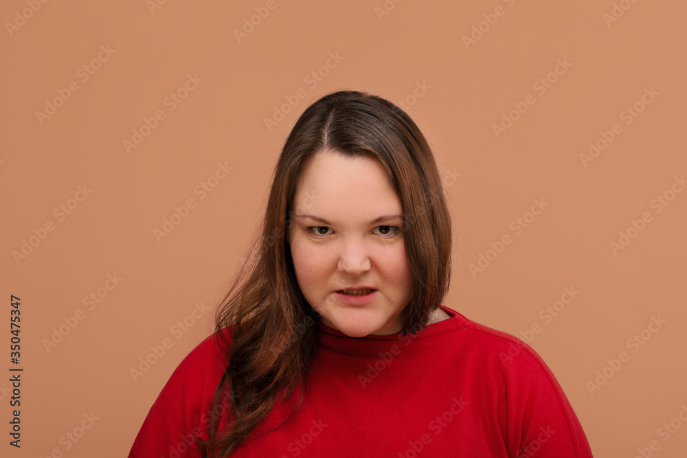 The evil girl is gritting her teeth and looking into the camera. The evil girl is gritting her teeth and looking into the camera.