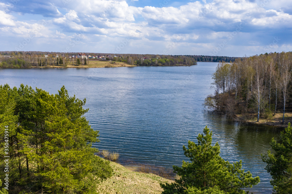 Spring landscape with the Uvodsky reservoir and a beautiful cloudy sky.