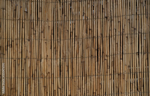 the texture of the wall made of bound bamboo bars