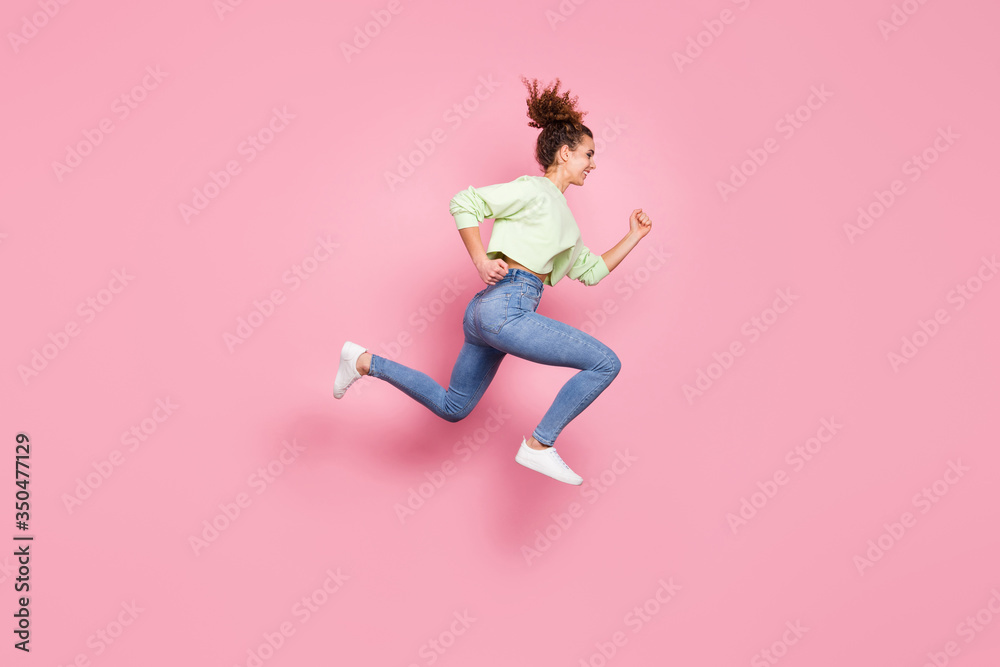 Full length body size view of her she nice-looking attractive lovely motivated purposeful cheerful cherry girl jumping running fast having fun isolated over pink pastel color background
