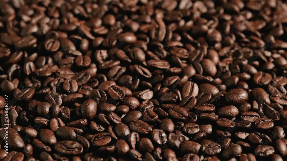 Coffee beans background rotating. Beautiful seeds of coffee. Coffee beans background rotating. Beautiful seeds of coffee.