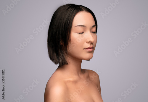 Peaceful ethnic model with closed eyes