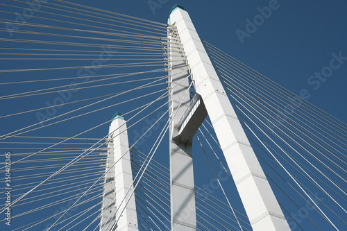 Cable-stayed road bridge against the blue sky  beautiful engineering solutions