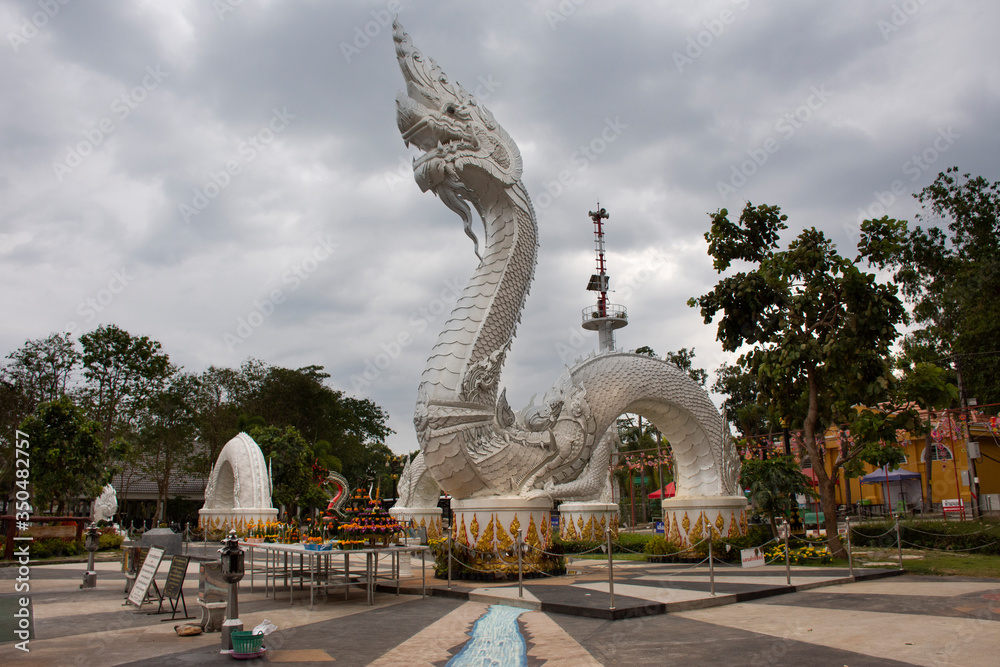 Big white naka statue for thai people travelers travel visit and respect praying at Kaeng kabao canyon at maekong riverside on October 12, 2019 in Mukdahan, Thailand