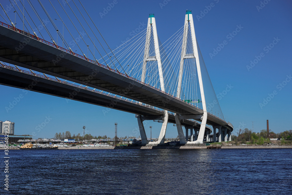 Cable-stayed road bridge against the blue sky, beautiful engineering solutions