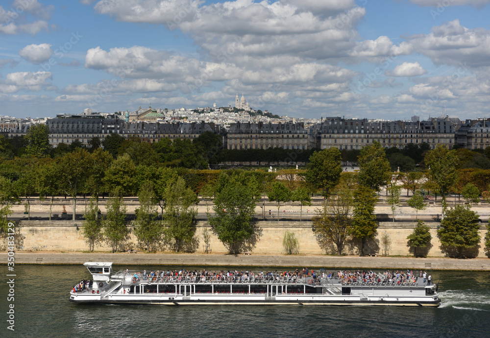 Tourist ship on the Seine river in Paris, France