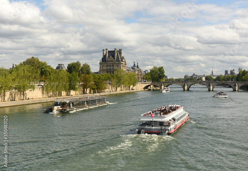 Tourist ship on the Seine river in Paris, France