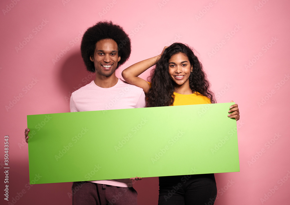 Portrait of African man and woman with green screen. Portrait of African man and woman with green screen.