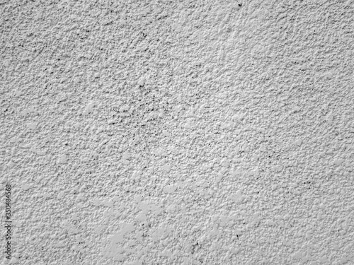 Putty concrete wall, spray cement concrete finisher. The texture of the background, spontaneously imposed on the wall is cement plaster. Abstract background.