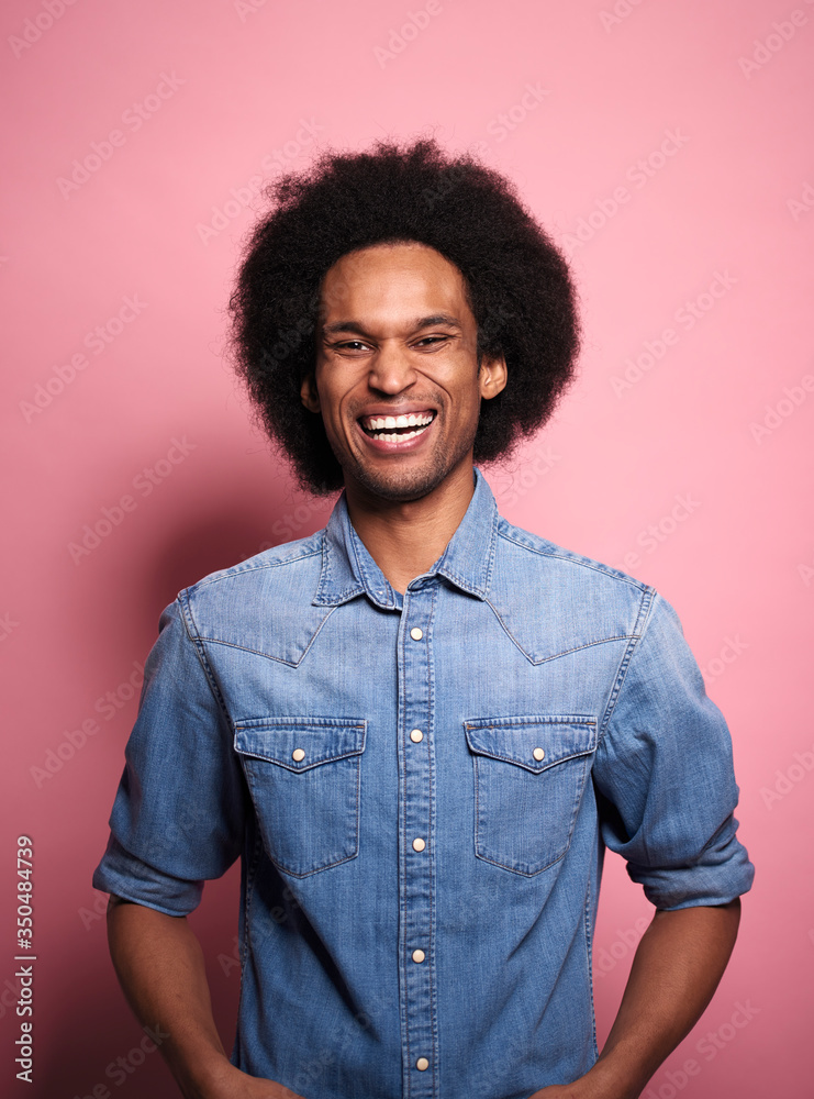Portrait of happiness young African man in a studio shot. Portrait of happiness young African man in a studio shot.