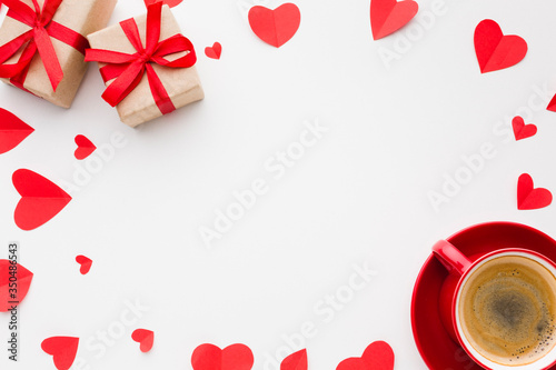 Top view of paper heart shapes and coffee for valentines day