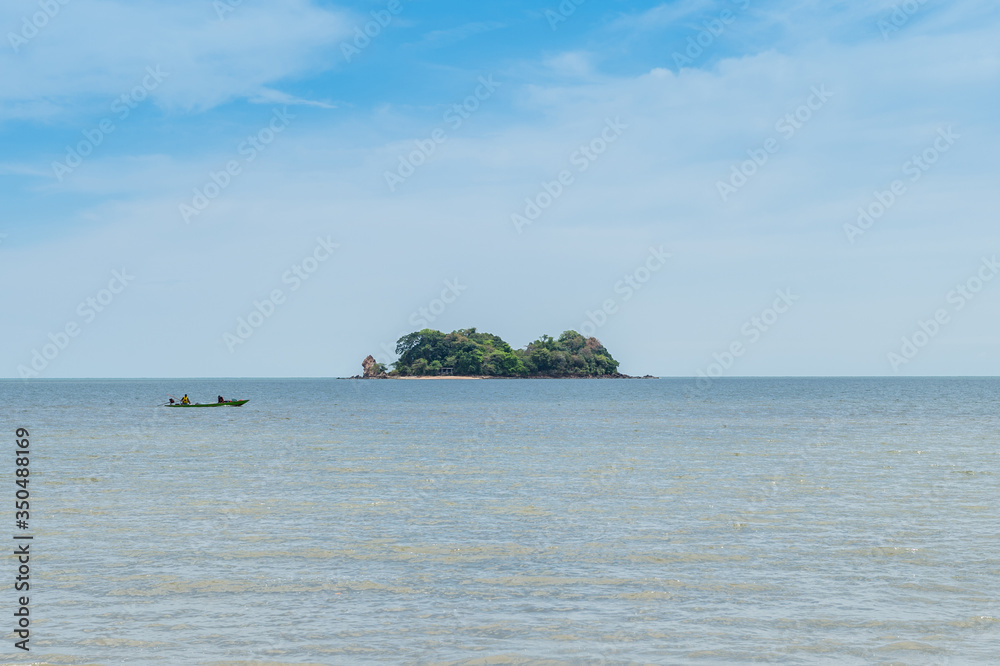 Closeup of island with boat on the ocean Closeup of island with boat on the ocean