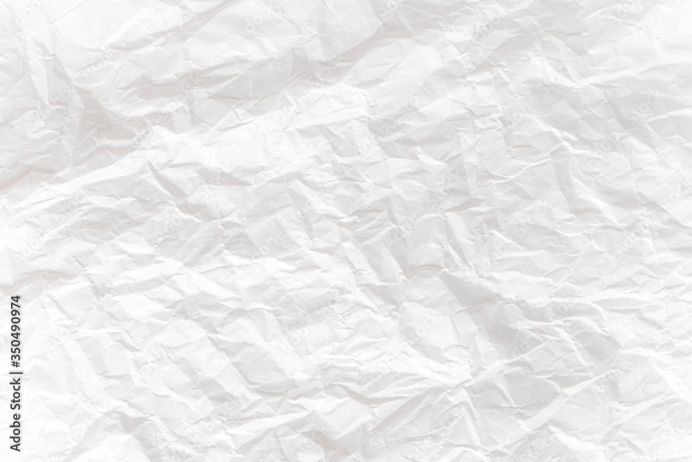 Obraz premium White crumpled paper close up texture background