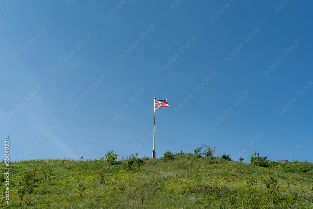 Union Jack flag flying on top of castle hill in Mere, Wiltshire.