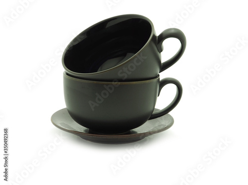 Empty dark brown coffee or tea cup stack isolated on a white backgroun..