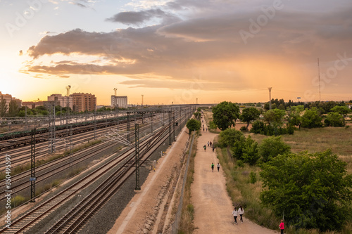 The roads parallel to the tracks at sunset
