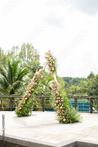 Beautiful and rustic garden wedding setup on a sunny day during summer.