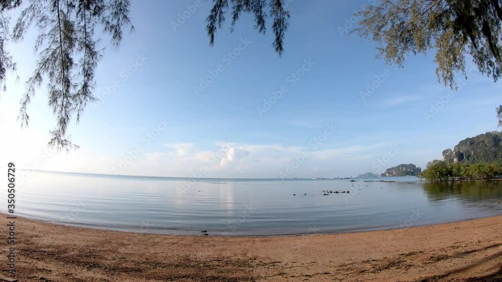 Time lapse motion Ocean waves that hit the beach Background in the sea and the clouds move fast on the sky. Time lapse motion Ocean waves that hit the beach Background in the sea and the clouds move fast on the sky.