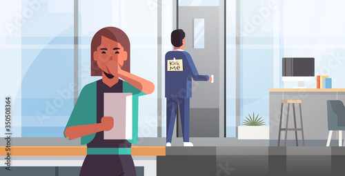 businesswoman luaghing sticky note with text kick me on back of businessman april fools day concept modern office interior horizontal vector illustration
