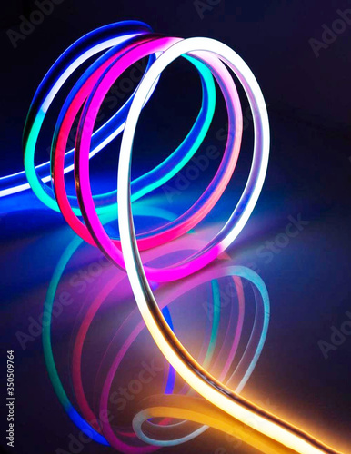 Flexible led tape neon flex in different colors on black background