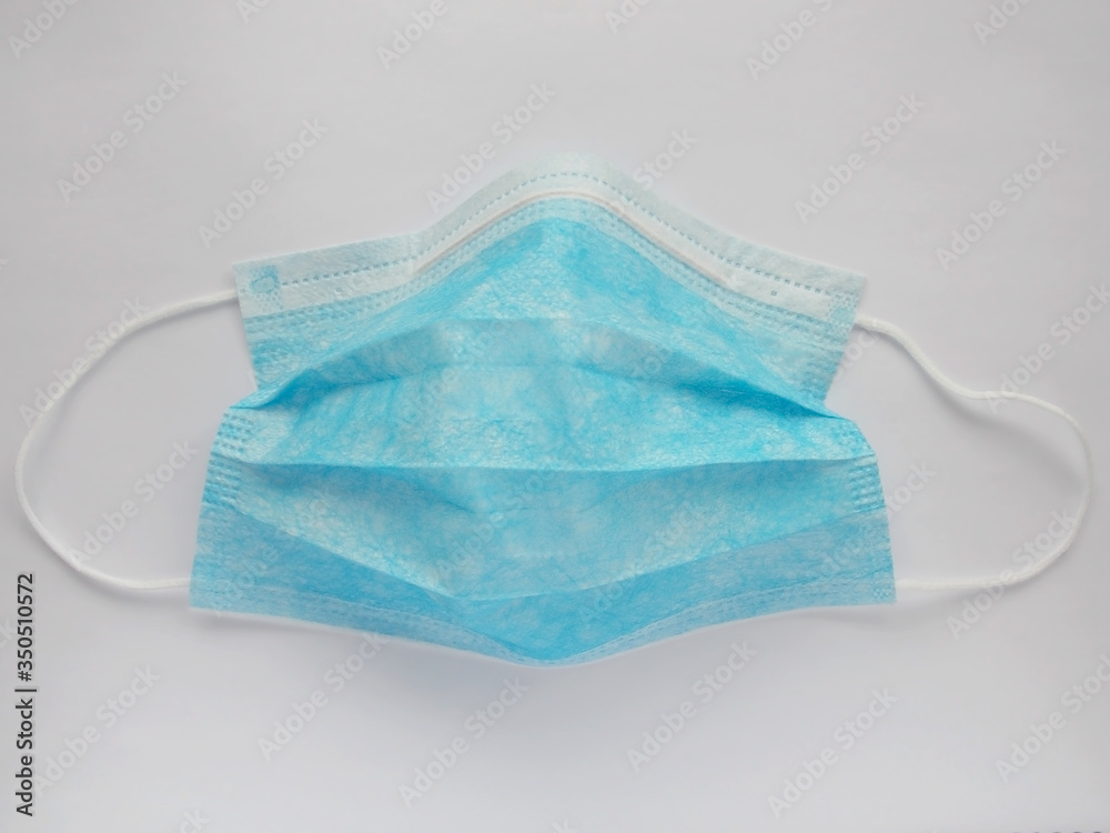 Medical sterile blue protective mask on a white background Medical sterile blue protective mask on a white background