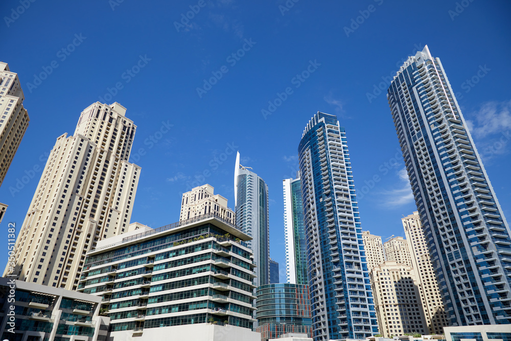 Dubai Marina skyscrapers, low angle view in a sunny day, clear blue sky in Dubai