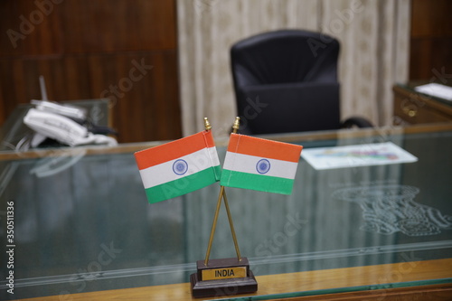 Indian tricolor flag placed on the executive table of a powerful government officer.